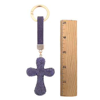 Purple rhinestone cross keychain with a ruler. 