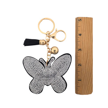 Silver rhinestone butterfly keychain with a ruler. 