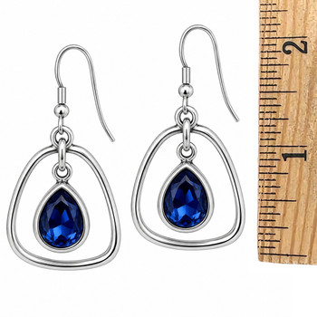 Sapphire blue teardrop crystal dangle earrings with a ruler. 