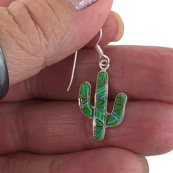 Green cactus Gaspeite and Opal dangle earrings in my hand. 