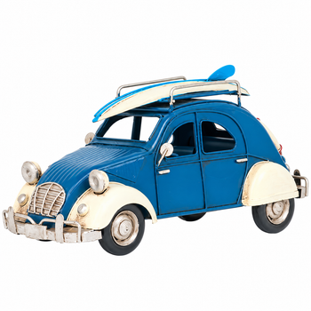 Vintage blue and cream Volkswagen Beetle-inspired metal decorative car featuring a blue and white surfboard on the roof rack, distressed detailing, silver-tone bumpers, and classic retro styling. Measures 10.2" long x 5" high.