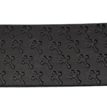 Close up picture of embossed cross black leather belt.
