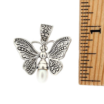 Size of butterfly with a Pearl. Size of butterfly with a Pearl.