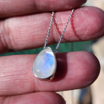 Picture in sun to get flash of Moonstone pendant necklace. 