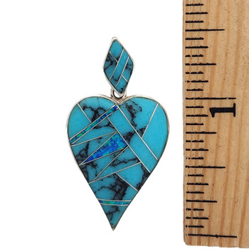 Size of inlaid Turquoise and Opal silver pendant. 