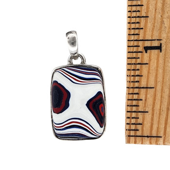 Size of small rectangle white Fordite silver pendant. 