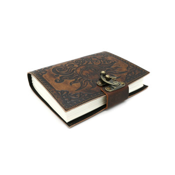 Side view of the celestial embossed sun and moon leather journal. 