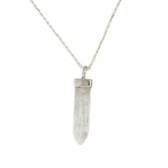 Moonstone point pendant on a chain necklace. 