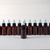 Set Of 12 Plastic Amber Bottles & Liquid Dispensing Cap - 2 oz.