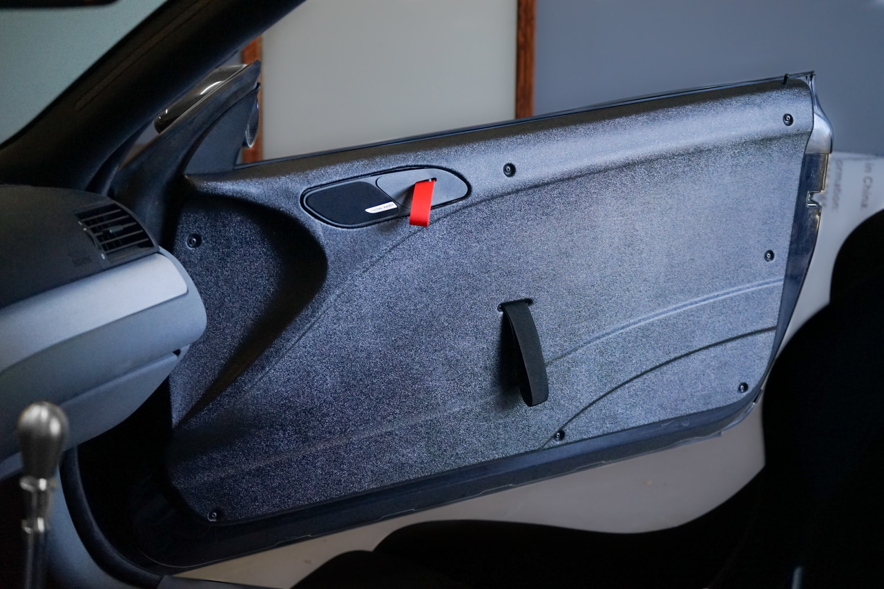HARD Motorsport thermoformed left and right Door Panel set,
including mounting hardware and door pull strap for BMW E46 Coupe