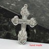 Sterling Silver Russian Orthodox Cross. Traditional design: the initials for Jesus Christ, IC XC, and a descending dove.  1¼" (33mm) Sturdy (not thin), hand cast in small quantities using the lost wax method. Perfect for an adult baptism.