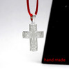 Sterling Silver Orthodox Soldier's Cross. The raised design of this cross incorporates the Arma Christi, or Instruments of the Passion. These are the staff with the sponge and the spear. The cross arises from the Mount of Golgotha, also known as Calvary, which was the site immediately outside Jerusalem's walls where Jesus was crucified. On the reverse of the cross is a quote in Church Slavonic from Psalm 68 which begins "Let God arise, let His enemies be scattered." 1" (28mm). Sterling silver, cast by hand in small batches using the lost wax method. Elegantly gift boxed.