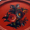 Antique Painted Tray "Bouquet on red background". Zhostovo Work Artel, circa 1930. Painted flowers on a tin tray. The history of Zhostovo arts and crafts (Жостовская роспись) dates back to the early 19th century. Its roots align with painted lacquered objects on papier-mache and Ural Tagil flower painting, which appeared earlier in the 18th century. In 1922 «Novosel'tsevo work artel» was founded in Novosel'tsevo in the Podmoskovye region, which made lacquered metal trays. In 1924 "Zhostovo work artel" and "Spetskustar" were also founded there and in 1925 two more, "Lakirovshik" and "Svoy trud". In 1925, all of them were combined into one artel "Metallopodnos". Today, it is named The Zhostovo Factory of Decorative Painting (Жостовская фабрика декоративной росписи).  Marked "Made in the Soviet Union" in white lettering at the bottom of the back of the tray.