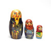 Family (Семья). Family, household, kin, ancestors, tribes and generations are important cultural milestones and landmarks. Relatives are close to one another (usually) and help each other in times of need (usually). The interdependence of family, including extended family, is of utmost importance. Aunts, uncles, and especially grandparents, play an outsized role in raising children, helping parents, and in many cultures, often live together.

Which is why nesting dolls with families are a common theme. This colorful matryoshka from 1993 even has the word "семья" ("family" in Russian) written at the base of the head doll. And what a family it is! Grandfather carries a teapot and bagels, babushka a samovar and bowl, an Orthodox priest with Easter eggs, a blacksmith and a daughter carrying two green sacks. The artist's choice of characters is eclectic. 7" down to 1¾". Signed by the artist.