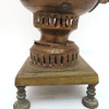 Pre-revolutionary small brass samovar. An unusual addition to a samovar collection. Hand made, probably Tula - see the array of nuts holding the knobs. In distressed, used condition. Theories abound for this one. 1) it might have been carried around for a quick boil of water to prepare one or two cups of tea, 2) it's part of a child's tea set, and 3) it was a salesman's sample.