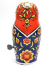 Mechanical Matryoshka (Механическая Матрешка). This entertaining Matryoshka spins one way and then the other, back and forth. Made in the Soviet Union pre-1991 at LZM (Leningradskiy Zavod Metalloizdeliy). Dark blue color. With key.