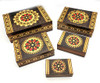 Set of 5 nested wooden Polish boxes. Crafted in Zakopane (Podhale region), a town which lies at the foothills of the Tatra Mountains. Each box is identically carved and stained with decorations incised using the techniques of the craft of traditional pyrography (woodburning). Boxes are lined with bright red felt (a nice touch), and nest perfectly within one another. The center of each box is a spiral flower with red and green enhancements and the surrounding wood is intricately textured. Three largest boxes have elaborate edge borders. An unusual set in brand new condition.