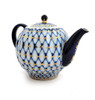 Cobalt Net Small Teapot. This fine porcelain small teapot is hand decorated in the classic Cobalt Net pattern.  In Russia, tea is usually served with the help of two teapots, one large and one small. The smaller one would hold a strongly made brew, while a larger teapot, or a kettle, would dispense the hot water, which then is mixed together to make a cup of tea to taste.  Fully hand painted and decorated at the former Lomonosov Porcelain Factory in St. Petersburg, Russia (factory is now known as The Imperial Porcelain Factory). Red "Made in USSR" backstamp indicates manufacture was pre-1991. This is the genuine article and not a foreign knockoff. Mineral cobalt, 22Kt gold.
