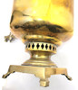 Large and heavy pre-revolutionary brass samovar.  1890-1910. Tula, Russia. In about fine condition, no major dents or missing parts. The golden brass is warm quality and has been cleaned often by the former owner. About 19¾" in height and weighs slightly over 13½ lbs. The inside chamber has calcium and mineral deposits indicative of prior use. The burn chamber plate, essentially a grill, is intact and clips on.  All parts, including key, grips, cap, etc., appear to be original.e factory award medals and identification has been polished nearly out of existence, but a closer look reveals the word "Ivan" and "Batashev". The era is 1890-1910. Ivan Grigoryevich Batashev is one of the most famous and well-known samovar makers in Tula