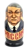 Yeltsin with Leaders (Ельцин с Вождями). The whole line of succession, from Yeltsin down to the beginning of the monarchy, is depicted in this 10 piece set. Larger dolls with more than 5 pieces are less common due to the cost of production.  A solemn Boris Yeltsin, the first post-Communist leader, heads off the caravan. A banner proclaims "Россия" (Russia) in red letter and the white, blue and red flag is painted on the back. Gorbachev in his characteristic blue suit has a yellow sash with the word Перестройка (Perestroika). His birthmark has the letters CCCP added. More leaders follow: 10 in all!
