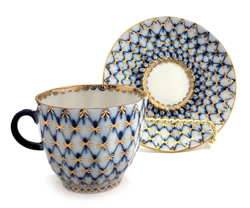 Cobalt Net Coffee Cup and Saucer. Cobalt net is the trademark style of the Lomonosov Porcelain Factory, which first appeared in 1949. The pattern is a combination of hand painted intersecting lines, or netting, of cobalt blue with inverted tear drops of cobalt blue (made from mineral cobalt) and 22 karat gold accents. Cup is 2½" high and 2¾" diameter. Saucer is 4½" diameter. Red ЛВЗ (LFZ) backstamp and "Made in USSR" in English, indicating pre-1991 manufacture.