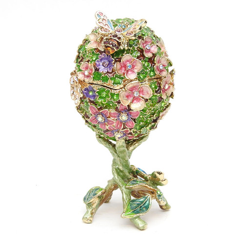 Victorian Art Nouveau Egg Box. A bygone-era is evoked by this exquisite and finely detailed enamel egg. A bee and butterfly are attracted by the colorful flower arrangement. The bee symbolizes the sun and the butterfly symbolizes the soul and resurrection. Loosely based on the "Paskha" Easter egg created by Mikhail Perchin in 1902, who worked as master jeweler in the Faberge firm in St. Petersburg. The original was given to Empress Alexandra by her husband, Tsar Nicholas II.