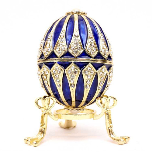 Pearl Blue Egg Box. The style of Peter Carl Faberge is evoked by this elegant hand enameled Royal Blue hinged egg box, with a large imitation pearl at each end. The enamel is baked onto a pewter base, then polished and set with genuine Austrian crystals. 2½" egg. Stand lifts it up, to show it off.  Makes a wonderful gift and can used to store small jewelry. Comes in a satin-lined presentation box. Pearl Blue Egg Box. The style of Peter Carl Faberge is evoked by this elegant hand enameled Royal Blue hinged egg box, with a large imitation pearl at each end. The enamel is baked onto a pewter base, then polished and set with genuine Austrian crystals. 2½" egg. Stand lifts it up, to show it off.  Makes a wonderful gift and can used to store small jewelry. Comes in a satin-lined presentation box.