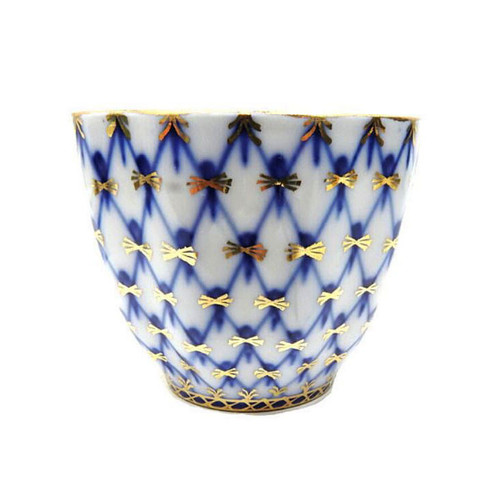 Cobalt Net Serving Cup. An unusual serving piece from the Lomonosov Cobalt Net line. Cobalt Net is the trademark pattern produced by the Lomonosov Porcelain Factory. The pattern first appeared in 1949. It is a combination of hand painted intersecting lines, or netting, of cobalt blue with inverted tear drops of cobalt blue and 22 karat gold accents.