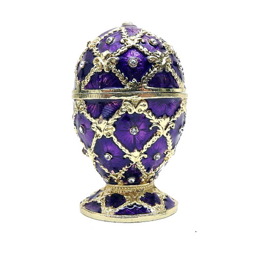 Royal Plum Netting Egg Box. The style of Peter Carl Faberge is invoked by this elegant enameled miniature egg box. The enamel is baked onto a pewter base, then polished and finally set with genuine Austrian crystals. The egg is hinged and can store small jewelry. Custom fitted gift box included Royal Plum Netting Egg Box. The style of Peter Carl Faberge is invoked by this elegant enameled miniature egg box. The enamel is baked onto a pewter base, then polished and finally set with genuine Austrian crystals. The egg is hinged and can store small jewelry. Custom fitted gift box included