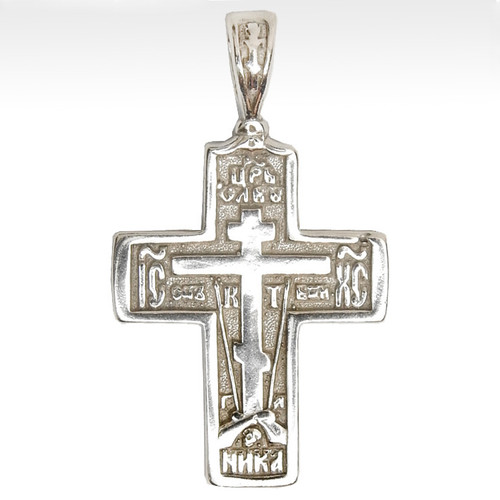 Sterling Silver Orthodox Soldier's Cross. The raised design of this cross incorporates the Arma Christi, or Instruments of the Passion. These are the staff with the sponge and the spear. The cross arises from the Mount of Golgotha, also known as Calvary, which was the site immediately outside Jerusalem's walls where Jesus was crucified. On the reverse of the cross is a quote in Church Slavonic from Psalm 68 which begins "Let God arise, let His enemies be scattered." 1" (28mm). Sterling silver, cast by hand in small batches using the lost wax method. Elegantly gift boxed. Sterling Silver Orthodox Soldier's Cross. The raised design of this cross incorporates the Arma Christi, or Instruments of the Passion. These are the staff with the sponge and the spear. The cross arises from the Mount of Golgotha, also known as Calvary, which was the site immediately outside Jerusalem's walls where Jesus was crucified. On the reverse of the cross is a quote in Church Slavonic from Psalm 68 which begins "Let God arise, let His enemies be scattered." 1" (28mm). Sterling silver, cast by hand in small batches using the lost wax method. Elegantly gift boxed.