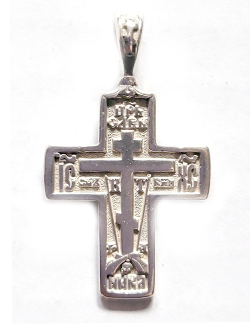 Sterling Silver Orthodox Soldier's Cross. The raised design of this cross incorporates the Arma Christi, or Instruments of the Passion. These are the staff with the sponge and the spear. The cross arises from the Mount of Golgotha, also known as Calvary, which was the site immediately outside Jerusalem's walls where Jesus was crucified. On the reverse of the cross is a quote in Church Slavonic from Psalm 68 which begins "Let God arise, let His enemies be scattered." 1" (28mm). Sterling silver, cast by hand in small batches using the lost wax method. Elegantly gift boxed.