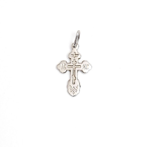 Sterling Silver Orthodox Baptism Cross. An elegant tiny silver cross is just perfect for a newborn. Elegant engraved design has the initials for Jesus Christ "ИС ХС" and a descending dove representing the Holy Spirit. A prayer in Russian on the back reads Спаси и Сохрани (Save and Protect). ½" (12mm). Sterling silver, cast by hand in small batches using the lost wax method. Elegantly gift boxed. Sterling Silver Orthodox Baptism Cross. An elegant tiny silver cross is just perfect for a newborn. Elegant engraved design has the initials for Jesus Christ "ИС ХС" and a descending dove representing the Holy Spirit. A prayer in Russian on the back reads Спаси и Сохрани (Save and Protect). ½" (12mm). Sterling silver, cast by hand in small batches using the lost wax method. Elegantly gift boxed.