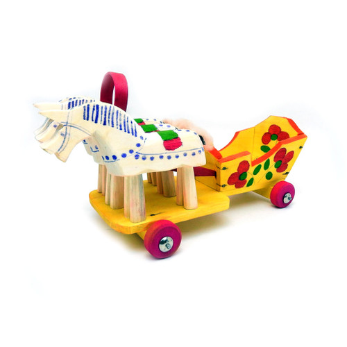 Fedoseyevo Troika (Федосеевская Тройка -Нижний Новгород). A team of three horses with simple painted patterns and "furry" tails. Originating out of the Nizhny-Novgorod region, not far from the town of Semenov, these bright colored and lightweight movable "splinter" toys were popular in the 1930's-1950's but began to lose favor and status. The Fedoseyevsky toy was revived for a time in the 1980s and today is in the hands of a very small group of folk artists. The painting is golden yellow patterned with naive floral designs. Authentic folk article from from Nizhni-Novgorod (formerly Gorky region). Wood, painting. Circa 1989-1991 (marked made in Russia with paper labels). 5" x 12". Brand new condition.