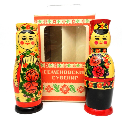 Semenov Souvenir (Сувенир "Семёновский"). A companion pair of late 1970's bottle holders in the original silk screened packaging with cellophane windows. Both open in the middle to hold a small bottle. Large USSR paper label on bottom of box. 8" in height. Both open to hide small bottles. The boy is a small version of the traditional 14" holder while the cosmonaut girl continues as a celebration souvenir of the Soviet space exploration program. In 1982 two Soviet cosmonauts gifted their French crewmate a pair. Originally it was intended to be a wedding pair. Semenov Souvenir (Сувенир "Семёновский"). A companion pair of late 1970's bottle holders in the original silk screened packaging with cellophane windows. Both open in the middle to hold a small bottle. Large USSR paper label on bottom of box. 8" in height. Both open to hide small bottles. The boy is a small version of the traditional 14" holder while the cosmonaut girl continues as a celebration souvenir of the Soviet space exploration program. In 1982 two Soviet cosmonauts gifted their French crewmate a pair. Originally it was intended to be a wedding pair.
