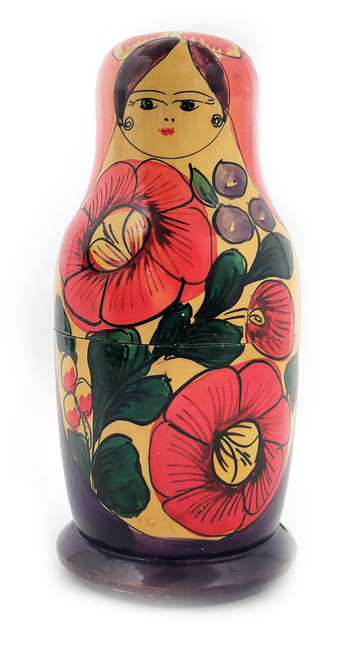 Polkhovsky-Maidan or Krutets (Полховский-Майдан или Крутец). A vintage pure folk art matryoshka with classical Polkh stylings. It's simply decorated with primary colors. Note the small eyes and the part of her hair - two curls peeking out from a long veil. Probably late 1950s-early 1960s. Uncommon. 3 nest, 6¾" in height