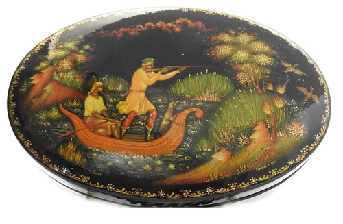 Hunters (Охотники). A young couple, together with their hound, pursue ducks from their small boat in the lagoon.  Papier-mache, egg tempera paints, lacquer. Detailed decorative freehand scroll border in gold. Authentic Palekh. "Made in USSR" in gold in the bottom of the box. Signed and dated 1991 by the artist in gold.