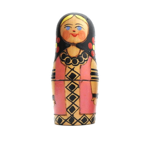 Volzhanka (Волжанка). This all-too cute matryoshka from Kalinin was named after Russia's most famous river: The Volga. Her style is different from other nesting doll centers, such as Viatka (aka Kirov or Nolinsk), Semenov or Polkh-Maidan. The wood is heavier and many of the decorative elements are burnt in. The colors are bright and the paint thickly applied. They tend to come in several color combinations, of which this one, the pink color, is the least common. 3 nest.