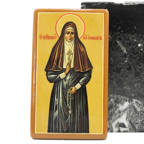 St. Elizabeth nursed wounded soldiers in hospitals and on the battle front. She founded a convent to take care of the sick. Small icon from Russia. Approximately 2¾"x4¾" Hand painted on wood. Only one.