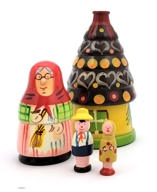 Hansel and Gretel and the Gingerbread House. Vintage Polish nesting toy from the 1980s. The Witch is the grandmotherly type with a button nose and the children are a set of peg dolls. A lot of interesting lathe work, traditional bright Polish colors and enhancements. In near fine, virtually unplayed with, and complete condition. A few decades ago, Polish artisans produced nesting dolls that were exported to the US, as well as elsewhere. House is about 5½" and children about 2" in height.