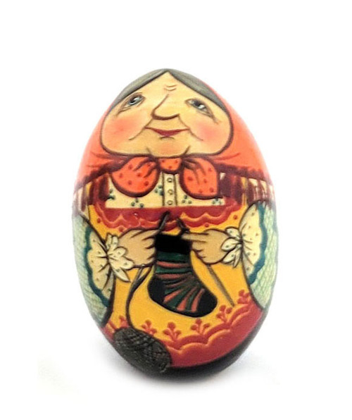 Babushka Knitting (Бабушка вяжет носок). Kindly grandmother knits a brightly colored sock. Signed by artist, dated 1990. Made in Moscow. 3".