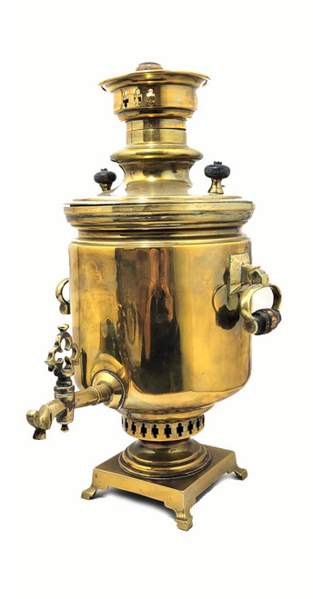 Large and heavy pre-revolutionary brass samovar.  1890-1910. Tula, Russia. In about fine condition, no major dents or missing parts. The golden brass is warm quality and has been cleaned often by the former owner. About 19¾" in height and weighs slightly over 13½ lbs. The inside chamber has calcium and mineral deposits indicative of prior use. The burn chamber plate, essentially a grill, is intact and clips on.  All parts, including key, grips, cap, etc., appear to be original.e factory award medals and identification has been polished nearly out of existence, but a closer look reveals the word "Ivan" and "Batashev". The era is 1890-1910. Ivan Grigoryevich Batashev is one of the most famous and well-known samovar makers in Tula