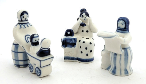 Set of three Gzhel figures including 1) Woman Reading a Newspaper (Женщина читает газету), 2) Woman Pushing a Baby Carriage (Женщина и коляска), and 3) Gossip (Сплетни). First two are from the 1970s from Turygino with backstamps, and third has a Gzhel backstamp indicative of later, post-Soviet breakup period. Sizes are 3¼", 2⅝" x 2½", and 3".