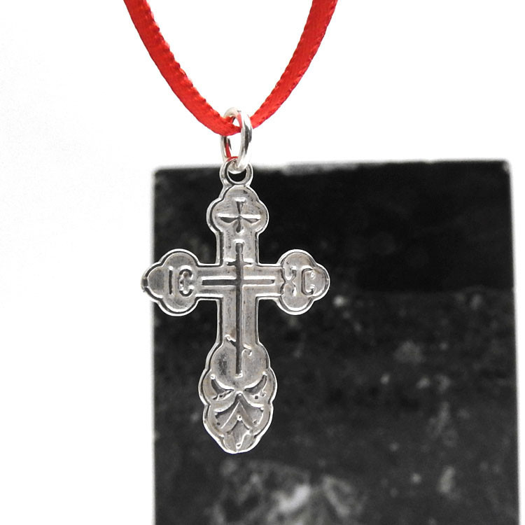St. Olga Sterling Silver Russian Orthodox Cross. Traditional high-relief design. The initials for Jesus Christ, IC XC, and a descending dove, symbolizing the Holy Spirit. With the short prayer on the back: "Спаси и Сохрани" (Save and Protect). 1" (25mm) Sterling silver, cast by hand in small batches using the lost wax method. Elegantly gift boxed. St. Olga Sterling Silver Russian Orthodox Cross. Traditional high-relief design. The initials for Jesus Christ, IC XC, and a descending dove, symbolizing the Holy Spirit. With the short prayer on the back: "Спаси и Сохрани" (Save and Protect). 1" (25mm) Sterling silver, cast by hand in small batches using the lost wax method. Elegantly gift boxed.