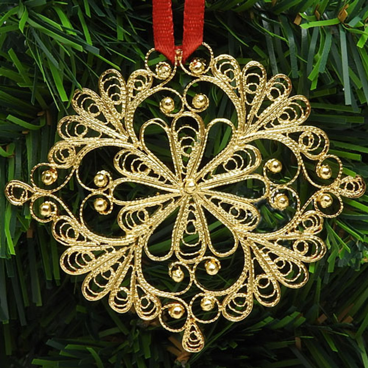 Snowflake (Снежинка) Ornament. Pure silver over copper. Gold plated. An exquisite Christmas ornament "spun" by hand in the village of Kazakovo. The original design was created by master artist Antonina Varlova, to evoke the charm and beauty of a delicate snowflake.