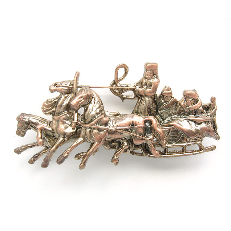 Troika Brooch. Show off your love for the Old Russia by displaying this intricate and elegant brooch. It has been nicely reproduced from an antique one, constructed from three separate pieces and an old-fashioned Victorian-style pin back. Made of pewter with a lovely satin antique gold finish.