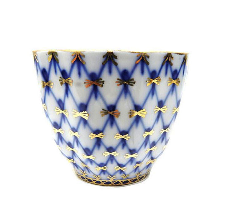 Cobalt Net Serving Cup. An unusual serving piece from the Lomonosov Cobalt Net line. Cobalt Net is the trademark pattern produced by the Lomonosov Porcelain Factory. The pattern first appeared in 1949. It is a combination of hand painted intersecting lines, or netting, of cobalt blue with inverted tear drops of cobalt blue and 22 karat gold accents.