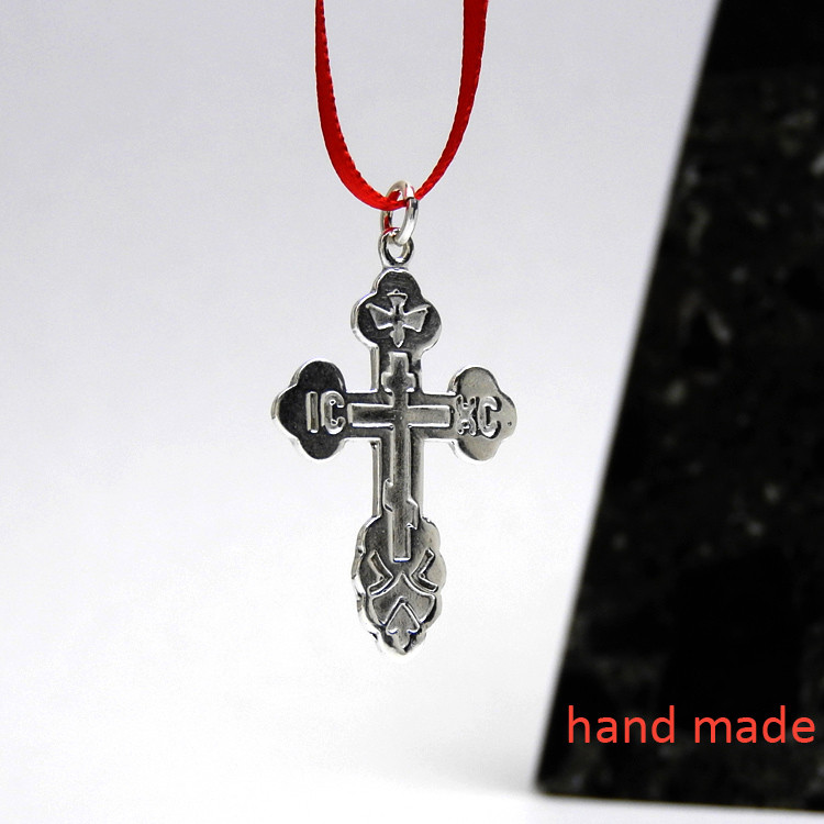 Sterling Silver Russian Orthodox Cross. Traditional design: the initials for Jesus Christ, IC XC, and a descending dove.  1¼" (33mm) Sturdy (not thin), hand cast in small quantities using the lost wax method. Perfect for an adult baptism.