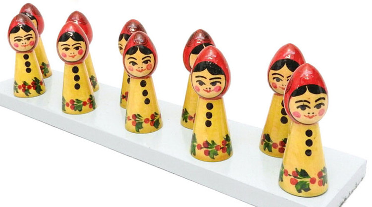 Cosmonauts "Counting" Nesting Toy. Ten brightly hand painted miniature cosmonauts on a pegged board. Semenov had a tradition of producing colorful and whimsical toys to instruct developing young minds. This set was made to teach children to count and recognize colors as well as to develop manual dexterity.