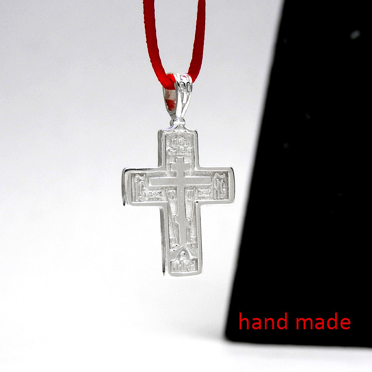 Sterling Silver Orthodox Soldier's Cross. The raised design of this cross incorporates the Arma Christi, or Instruments of the Passion. These are the staff with the sponge and the spear. The cross arises from the Mount of Golgotha, also known as Calvary, which was the site immediately outside Jerusalem's walls where Jesus was crucified. On the reverse of the cross is a quote in Church Slavonic from Psalm 68 which begins "Let God arise, let His enemies be scattered." 1" (28mm). Sterling silver, cast by hand in small batches using the lost wax method. Elegantly gift boxed.