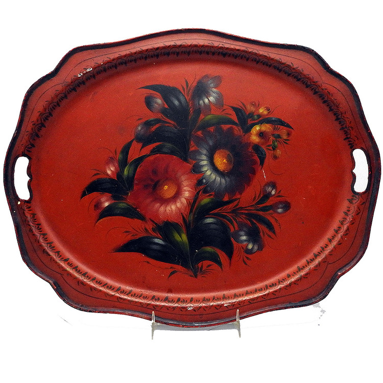 Antique Painted Tray "Bouquet on red background". Zhostovo Work Artel, circa 1930. Painted flowers on a tin tray. The history of Zhostovo arts and crafts (Жостовская роспись) dates back to the early 19th century. Its roots align with painted lacquered objects on papier-mache and Ural Tagil flower painting, which appeared earlier in the 18th century. In 1922 «Novosel'tsevo work artel» was founded in Novosel'tsevo in the Podmoskovye region, which made lacquered metal trays. In 1924 "Zhostovo work artel" and "Spetskustar" were also founded there and in 1925 two more, "Lakirovshik" and "Svoy trud". In 1925, all of them were combined into one artel "Metallopodnos". Today, it is named The Zhostovo Factory of Decorative Painting (Жостовская фабрика декоративной росписи).  Marked "Made in the Soviet Union" in white lettering at the bottom of the back of the tray.